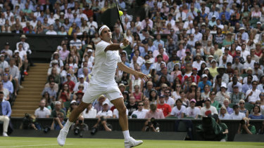 Roger Federer returns the ball to Japan's Kei Nishikori during their quarter-final match.