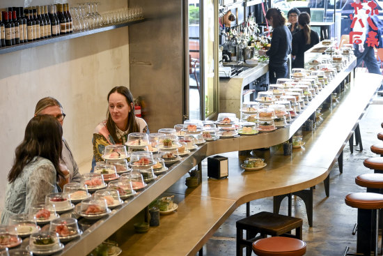 The sushi train, imported from Taiwan, fits the narrow Bourke Street site.