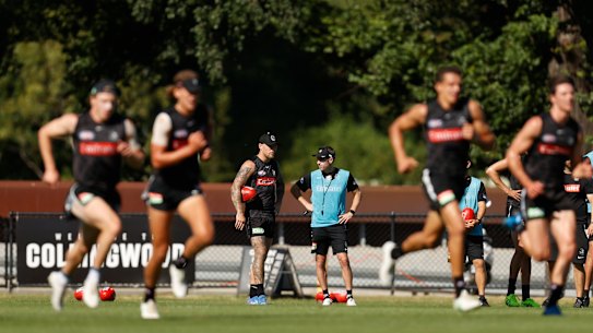 Collingwood coach Craig McRae chats to Jordan De Goey at a recent club training session.