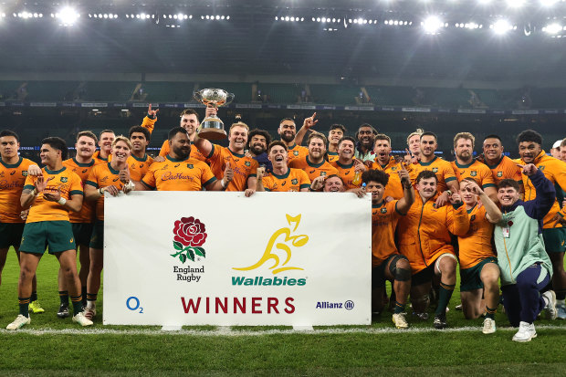 The Wallabies celebrate with the Ella Mobbs Cup after their victory.