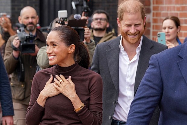 Meghan, Duchess of Sussex, and Prince Harry, Duke of Sussex, arrive at Himmah Hub, a food poverty community action group