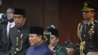 President Prabowo Subianto takes the oath during the presidential inauguration ceremony at the Parliament building in Jakarta on Sunday. 