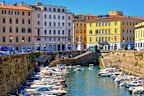 Livorno’s coloured houses and new fort sit on its canals.