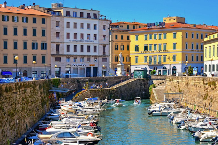 Livorno’s coloured houses and new fort sit on its canals.