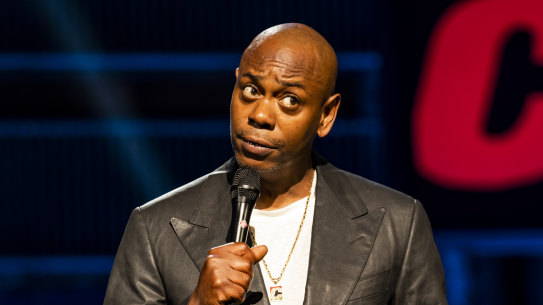 Dave Chappelle on stage performing his Netflix special, The Closer.