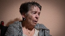 Maricarmen, 87, waits at home for police to arrive before being evicted from the home where she lived.