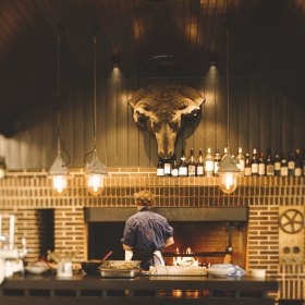 An Alan Scott brick oven commands the room. 