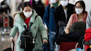 Passengers wear protective masks at Incheon International Airport in South Korea.