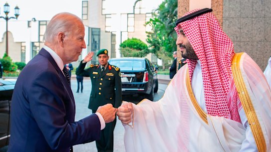 Saudi Crown Prince Mohammed bin Salman, right, greets US President Joe Biden with a fist bump in Jeddah.