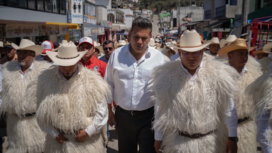 Senatorial candidate Willy Ochoa walks with other PRI candidates before beginning his rally in San Juan Chamula, Mexico.