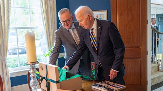 Anthony Albanese and Joe Biden exchange gifts.