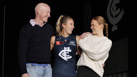 Carlton premiership player Andrew McKay with daughters Abbie, centre, and Sophie.