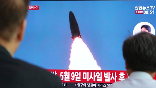 South Koreans watch a TV showing a report of a North Korea missile launch in an undated picture.