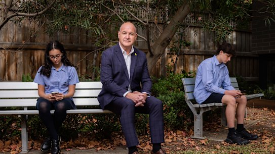David Opat, Deputy Headteacher at King David School in Armadale, with Year 9 students Minnie Rose and Noah Wise. Opat is leading the school's fight against social media.