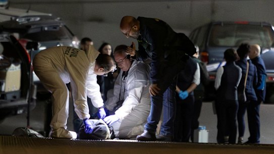Spanish Civil Guard officers investigate the garage where the body of Russian pilot Maxim Kuzminov was found after he was shot dead, in Villajoyosa, Spain.