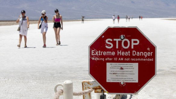 A stop sign warns tourists of extreme heat at Badwater Basin.