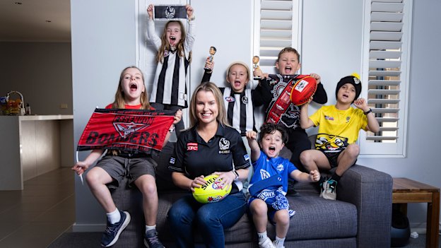 Casey Nunn shares the couch with young footy fans (from left) Charlotte, Chloe, Molly, Andre, Lachlan and Levi.