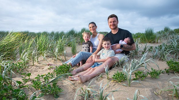 Matt Sinden and Whitney Tucker with their children Atlas, Kenzie and baby Scottie.