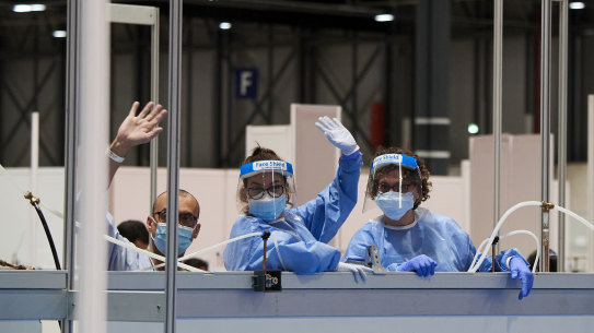 MADRID, SPAIN - APRIL 23: Coronavirus (Covid 19) patients pose to the camera at the COVID-19 IFEMA Hospital on April 23, 2020 in Madrid, Spain. Starting last week, some businesses deemed non-essential have been allowed to resume operations, and it is expected that from April 27 children under 12 will be allowed to come and go from their homes more freely. Spain has had more than 213,000 confirmed cases of COVID-19 and over 22,100 reported deaths, although the rate has declined after weeks of lockdown measures. (Photo by Carlos Alvarez/Getty Images)