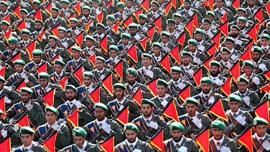 In this September 21, 2016, file photo, Iran’s Revolutionary Guard troops march in a military parade in Tehran, Iran. 