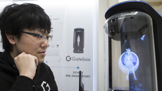 Japanese inventor Minori Takechi with virtual home robot Hikari Azuma.