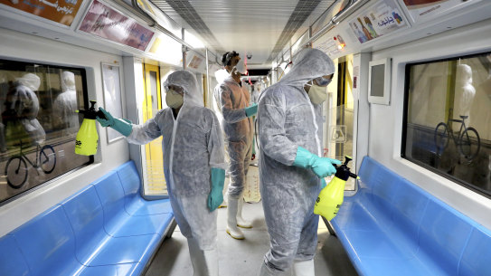 Health workers disinfect subway trains against coronavirus in Tehran, Iran.