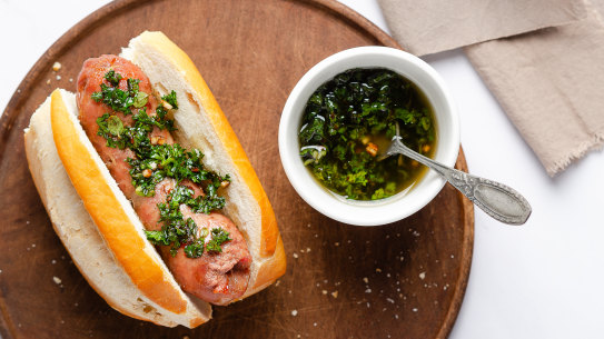 A choripan with chimichurri sauce.