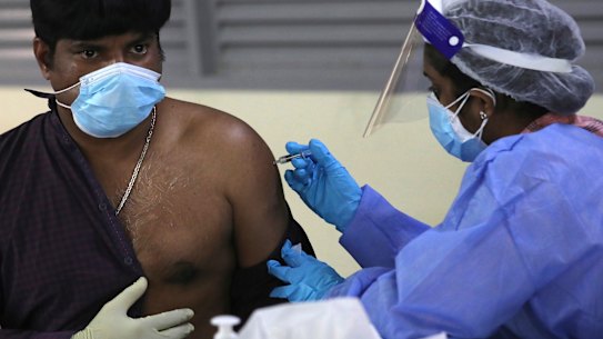 A man receives a Sinopharm COVID-19 vaccine in Dubai, United Arab Emirates.