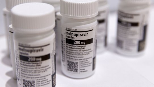 Bottles of Merck & Co. and Ridgeback Biotherapeutics’s Molnupiravir antiviral medication arranged in a warehouse.