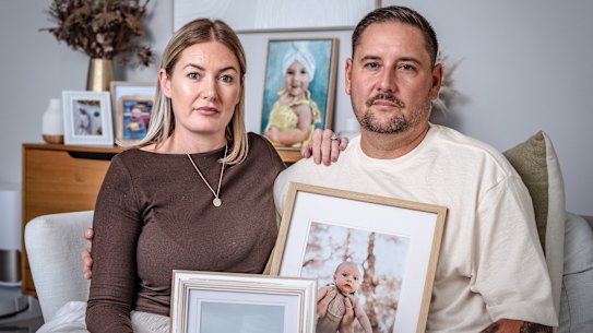 Danielle and Leon Green at home in Western Australia with photos of their children Sonny and Airlie.