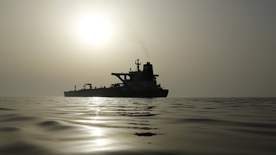 The impounded Iranian crude oil tanker, Grace 1, is silhouetted as it sits anchored off the coast of Gibraltar. Australia will join a US-led coalition to protect shipping in the Straits of Hormuz.