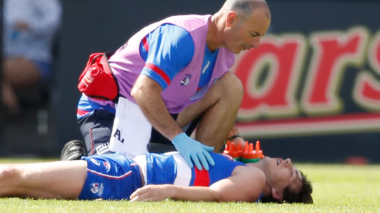  Liam Picken of the Bulldogs lies on the field injured during the AFL JLT Community Series match between the Western Bulldogs and the Hawthorn Hawks at Mars Stadium on March 3, 2018 in Ballarat.