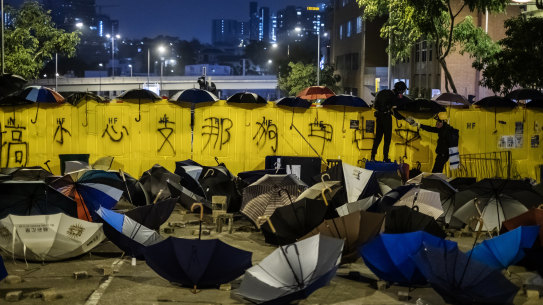 Umbrellas and barriers form a barricade on Junction Road during a protest outside the Hong Kong Baptist University in the Kowloon Tong area of Hong Kong, China, on Wednesday, Nov. 13, 2019. Hong Kong officials and Chinese state media warned of consequences if violence continued, as a third-straight day of protests disrupted traffic across the city and the government announced for the first time that it would close public schools. Photographer: Justin Chin/Bloomberg