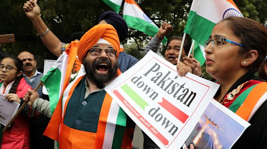 National Akali Dal leaders shout slogans in New Delhi as they celebrate the Indian Airforce bombing Pakistan territory on Tuesday, February 26.