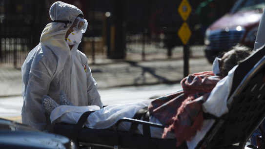 A patient is brought into the Elmhurst Hospital Centre in the Queens borough of New York.