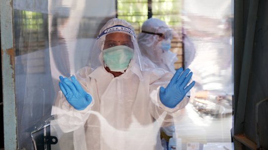 A healthcare worker at a COVID-19 testing centre in New Delhi.