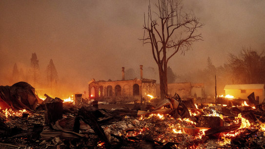 Buildings burn as the Dixie Fire this week tore through the Greenville community of Plumas County, California. The compounding events of weather extremes in a warming world will be part of the upcoming IPCC report.