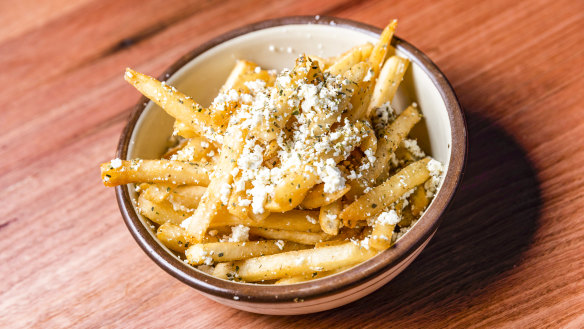 Chips with feta, garlic oil and oregano.