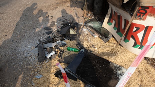 Shattered glass and other debris at the scene of the accident site in Nigeria.