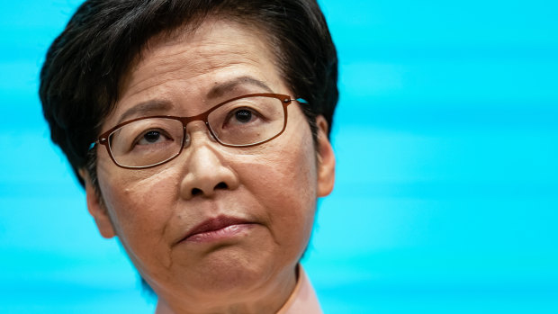 Hong Kong leader urges parents to spy on teens, as bomb plot emerges