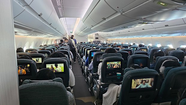 Economy seats are in a 3-3-3 layout.