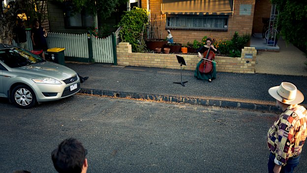 Taking it to the streets … chamber musician Josephine Vains plays a social distancing “concert” for her neighbourhood in Melbourne’s Brunswick.