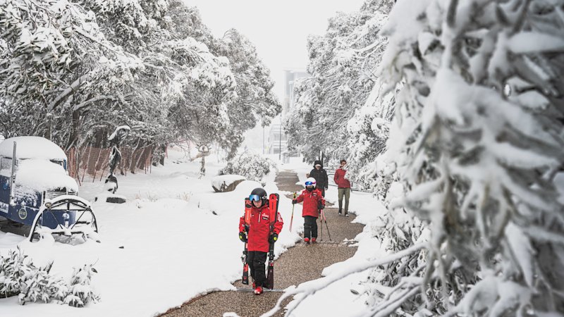 Farmers welcome the rain at last, but at least six people remain trapped at Mount Hotham