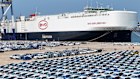 A BYD carrier loads cars for export in Yantai, Shandong Province.