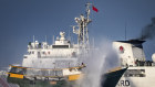 A Chinese Coast Guard ship fires a water cannon at a Philippine Navy vessel at Second Thomas Shoal in the South China Sea.