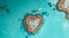 Heart Island's glass-bottomed boat positioned off Heart Reef.