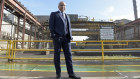 Sanjeev Gupta in front of an InfraBuild plant in Melbourne in 2017. The British industrialist acquired the operations out of the collapse of Arrium.