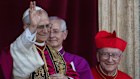 Newly elected Pope Leo XIV, left, formerly Cardinal Robert Francis Prevost, appears with, from left, Master of Ceremonies Archbishop Diego Giovanni Ravelli, and former Vatican Secretary of State Cardinal Pietro Parolin on the central loggia of St. Peter’s Basilica at the Vatican.