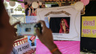 A voter poses for a photograph after casting her vote at a polling station in Mumbai during the fourth phase of voting in India's national elections.