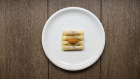 At Ora, slices of Arctic turnip are rolled around a creamy filling of whitefish, drizzled with dill oil, and topped with whitefish roe. 